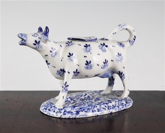 A Continental porcelain blue and white cow creamer, 16.5cm